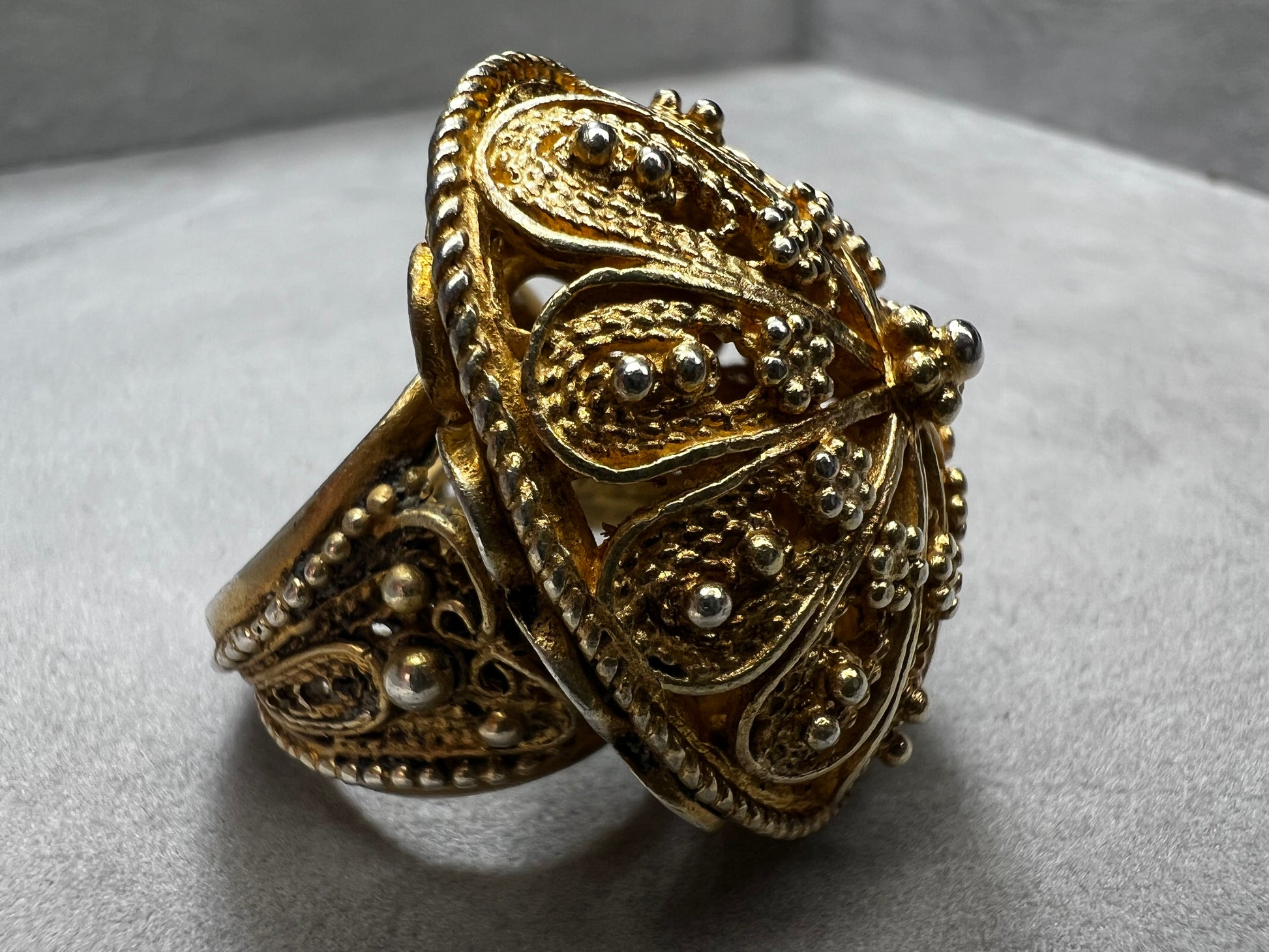 This remarkable antique ring, expertly made in Israel from sterling silver and finished with a gold wash, showcases exquisite early craftsmanship that is genuinely impressive.