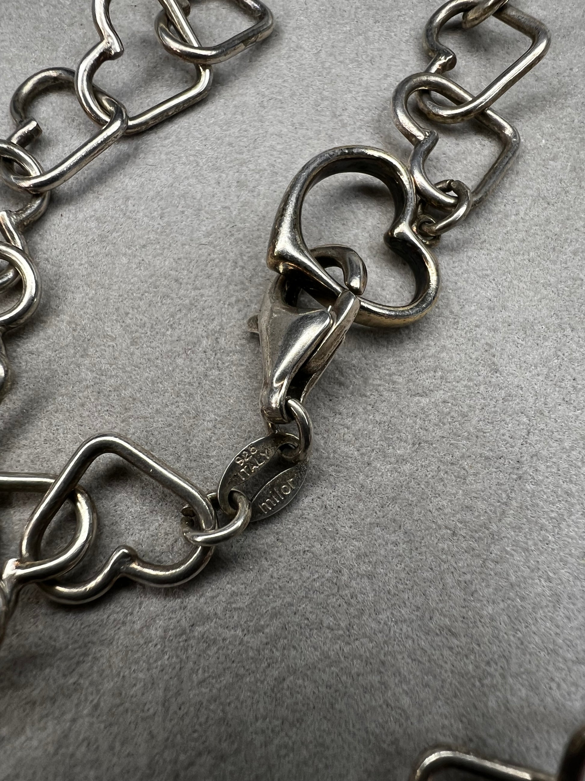 This 18" sterling silver necklace by Milor Italy showcases distinctive heart-shaped links, blending craftsmanship with elegant design. The unique link pattern is perfect for expressing personal style.