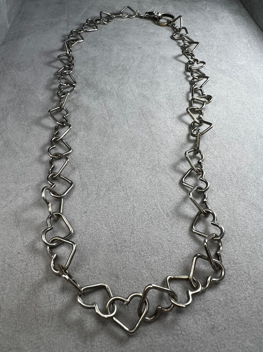 This 18" sterling silver necklace by Milor Italy showcases distinctive heart-shaped links, blending craftsmanship with elegant design. The unique link pattern is perfect for expressing personal style.