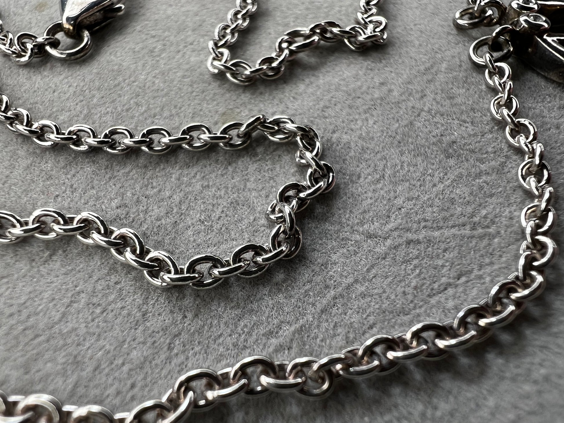 This stunning sterling silver necklace from Keith Jack features an intricate Celtic-inspired pendant, symbolizing eternity and unity. The pendant opens up for a different look when desired. The design is accented with four genuine diamonds, adding just the right amount of sparkle and elegance.