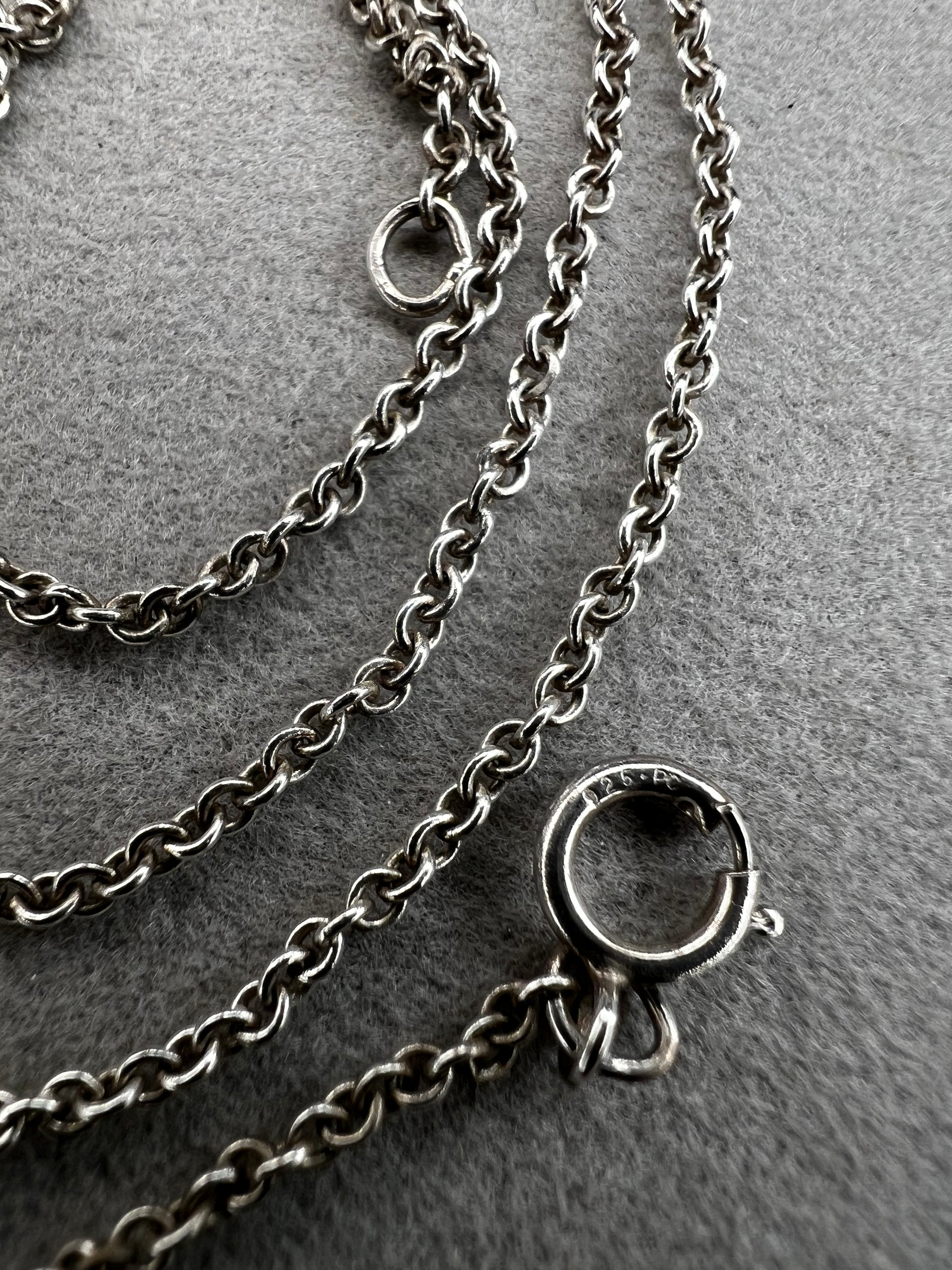 This sterling silver chain features a petite link. It is ready to be paired with a small pendant -- or wear it on its own for a touch of class.