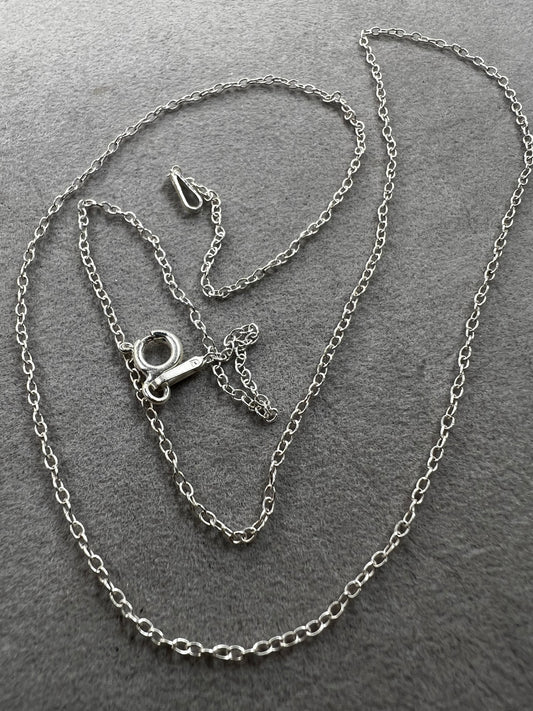 This petite sterling silver chain features a classic cable link, making it a versatile piece for your collection. It works on its own or layered with other necklaces -- or pair it with one of our small pendants.