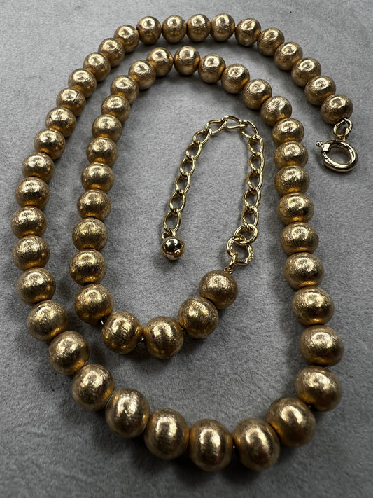 This 16" necklace features a gold-filled chain accented with gold-filled beads, designed to catch the light beautifully with every movement. It offers a refined yet versatile addition to elevate any wardrobe.