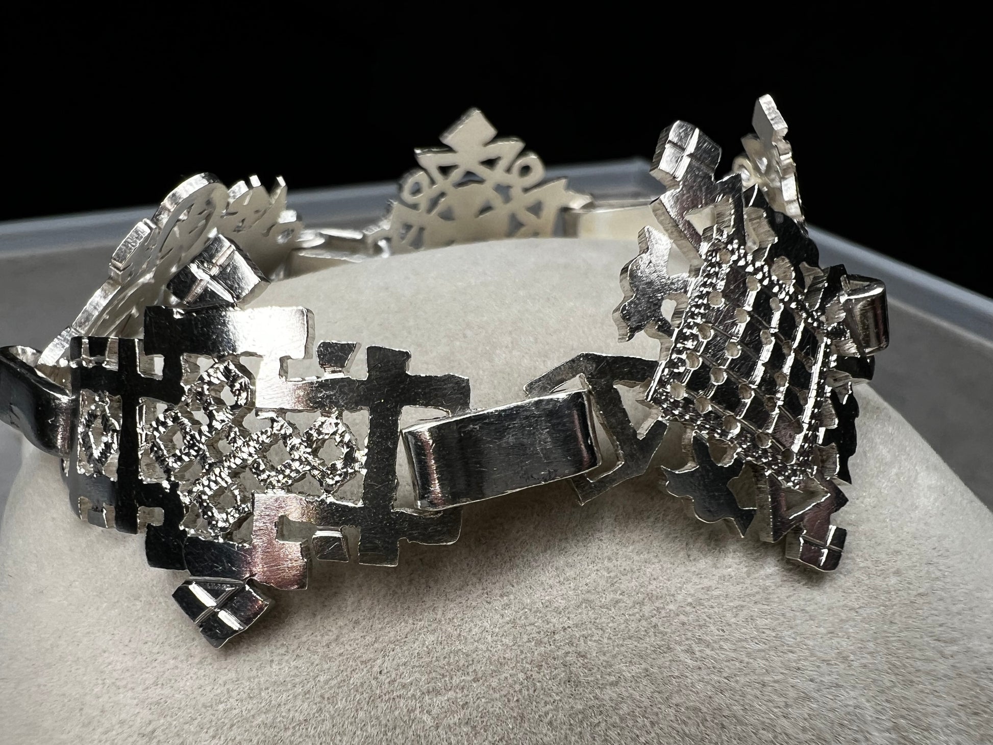Crafted in sterling silver, this vintage bracelet features five ornate openwork panels. A timeless design that makes a striking statement.