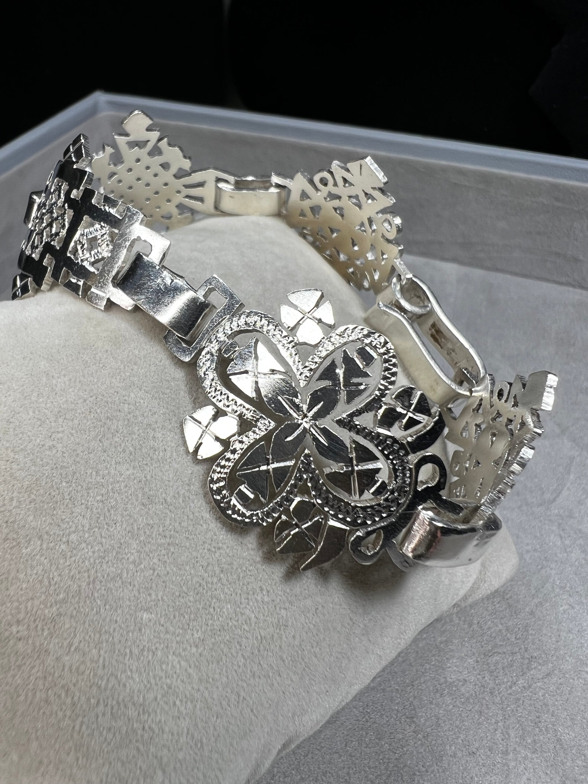 Crafted in sterling silver, this vintage bracelet features five ornate openwork panels. A timeless design that makes a striking statement.
