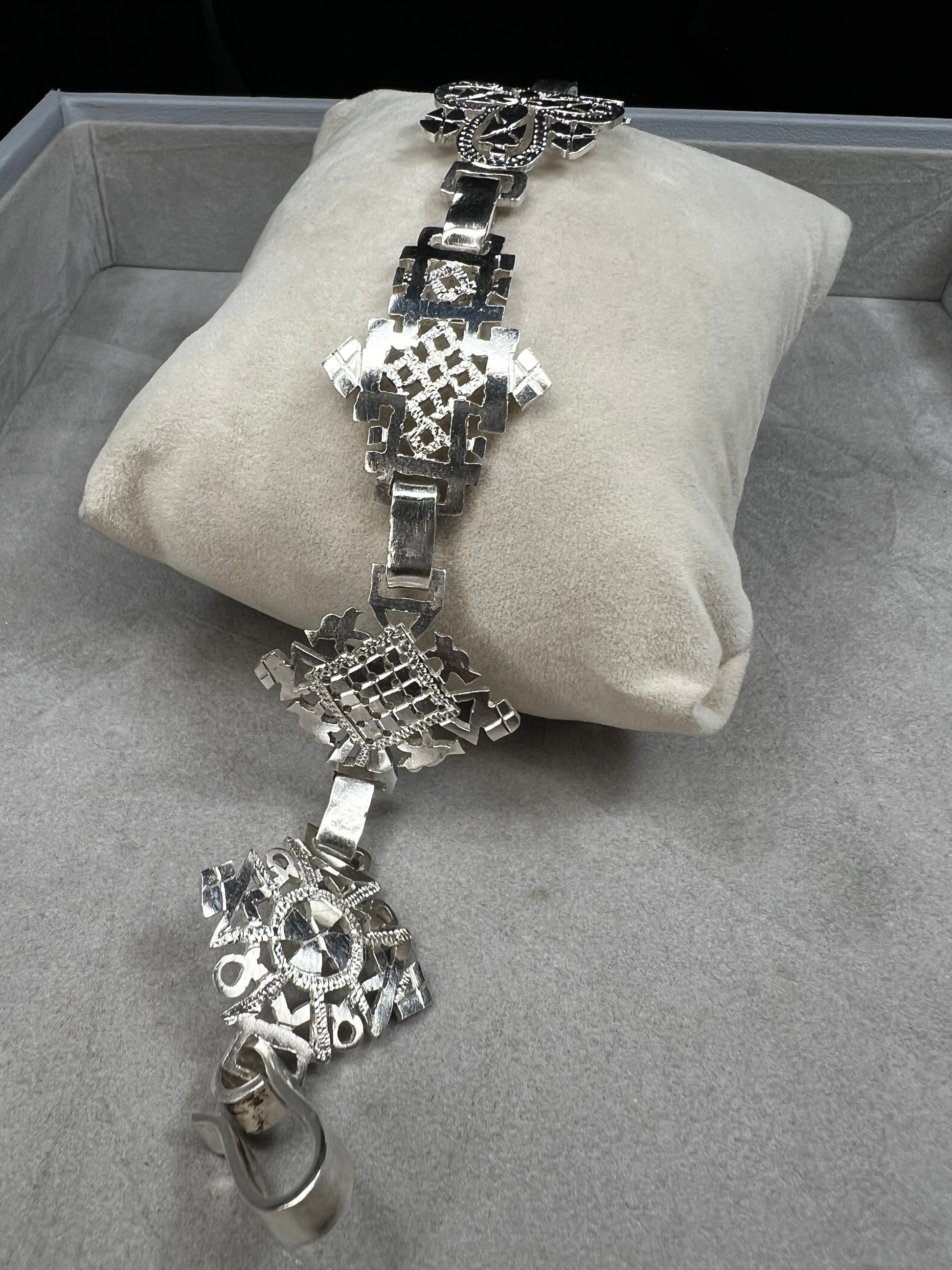 Crafted in sterling silver, this vintage bracelet features five ornate openwork panels. A timeless design that makes a striking statement.