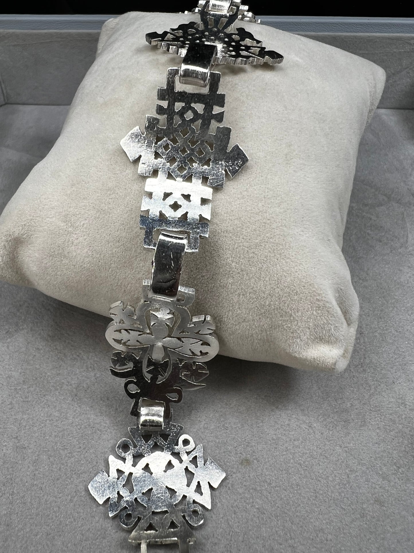 Crafted in sterling silver, this vintage bracelet features five ornate openwork panels. A timeless design that makes a striking statement.