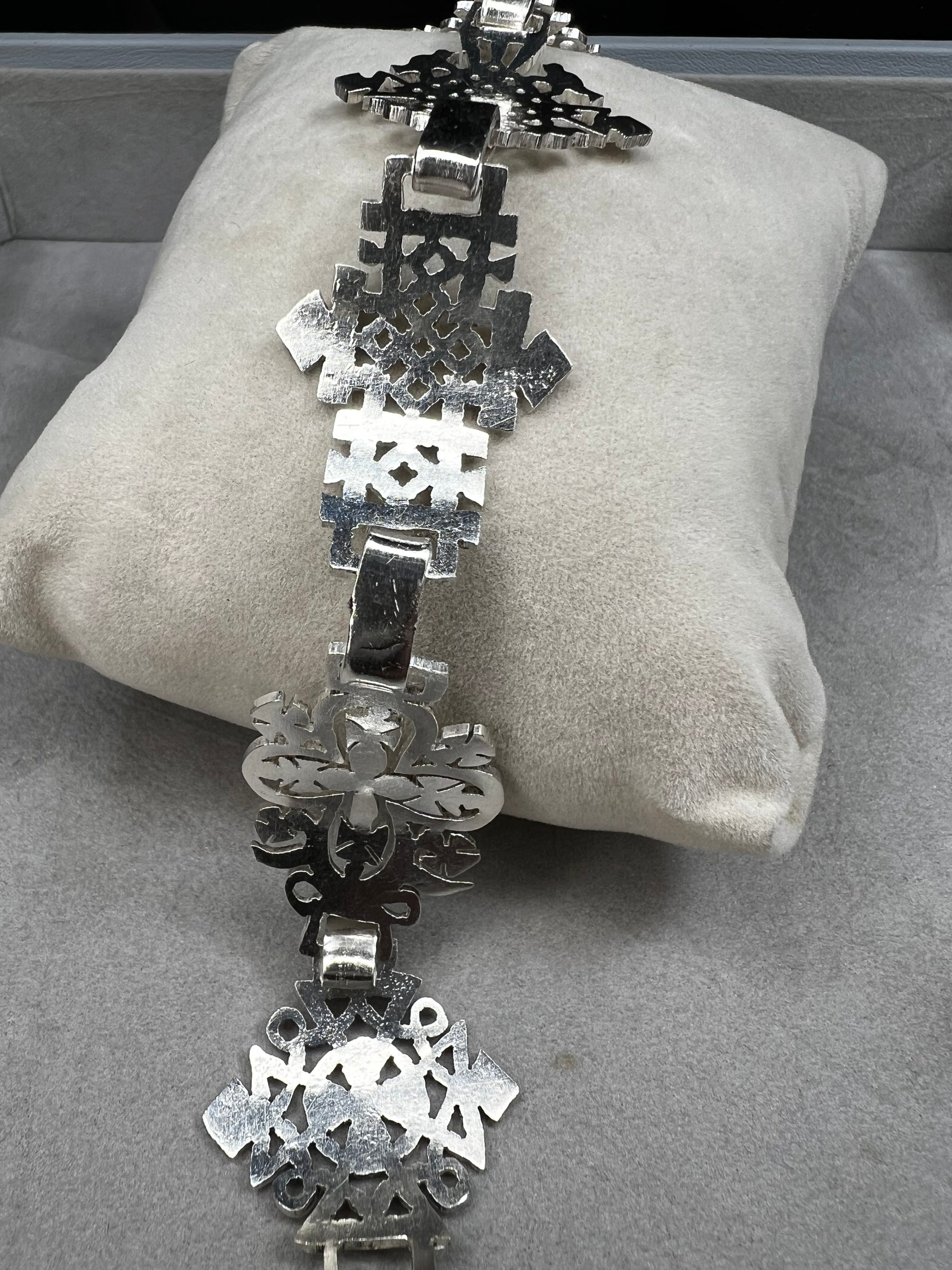 Crafted in sterling silver, this vintage bracelet features five ornate openwork panels. A timeless design that makes a striking statement.