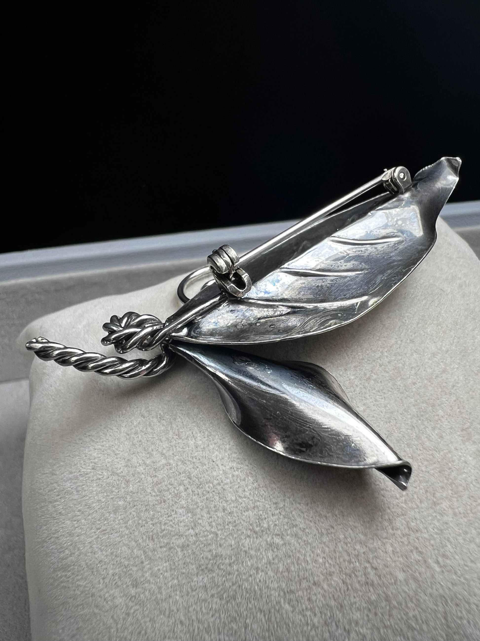 This sterling silver brooch features detailed craftsmanship that captures the beauty of nature -- perfect for anyone who loves the outdoors.