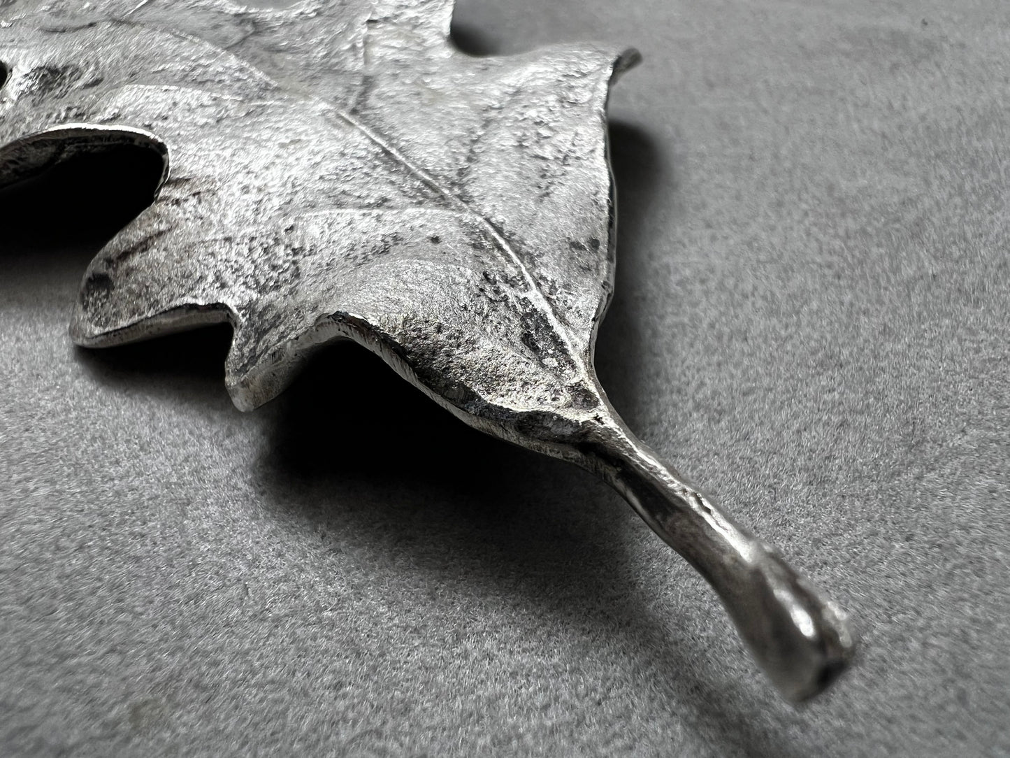 Shaped like an oak leaf, this sterling silver brooch captures nature’s beauty in exquisite detail. Its realistic design makes it a standout piece wherever it’s worn.