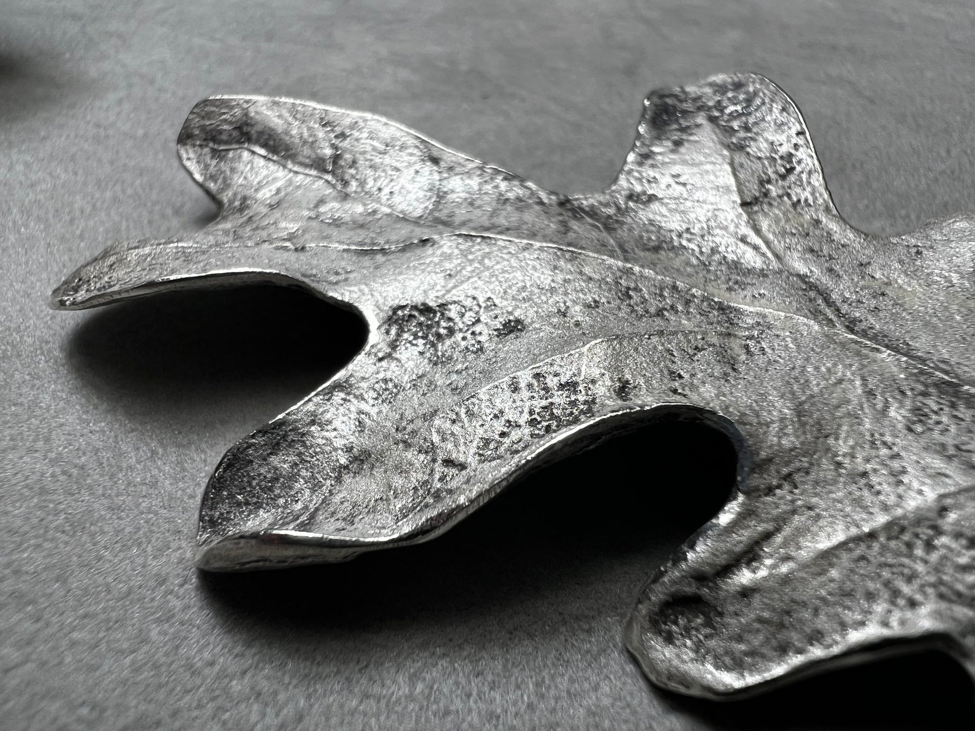Shaped like an oak leaf, this sterling silver brooch captures nature’s beauty in exquisite detail. Its realistic design makes it a standout piece wherever it’s worn.
