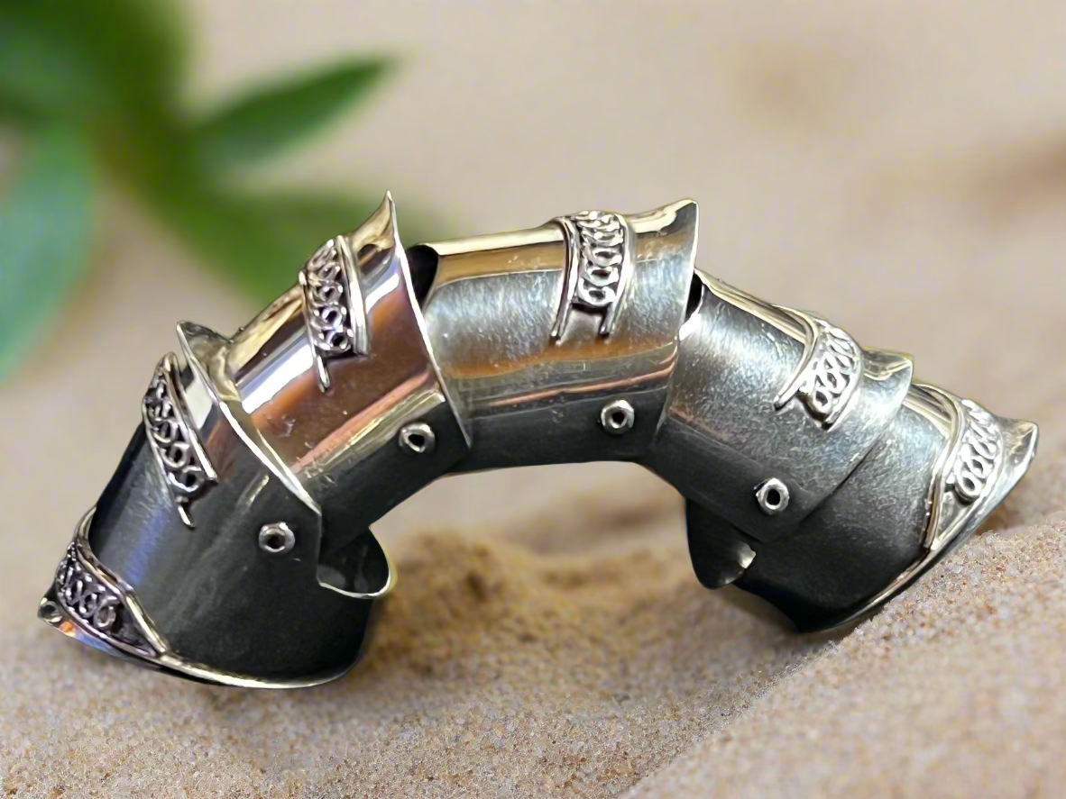 If you're looking for a ring that embodies individuality, this is it. Crafted from fine sterling silver, this full-finger ring is jointed -- which allows it to bend with the movement of your finger.