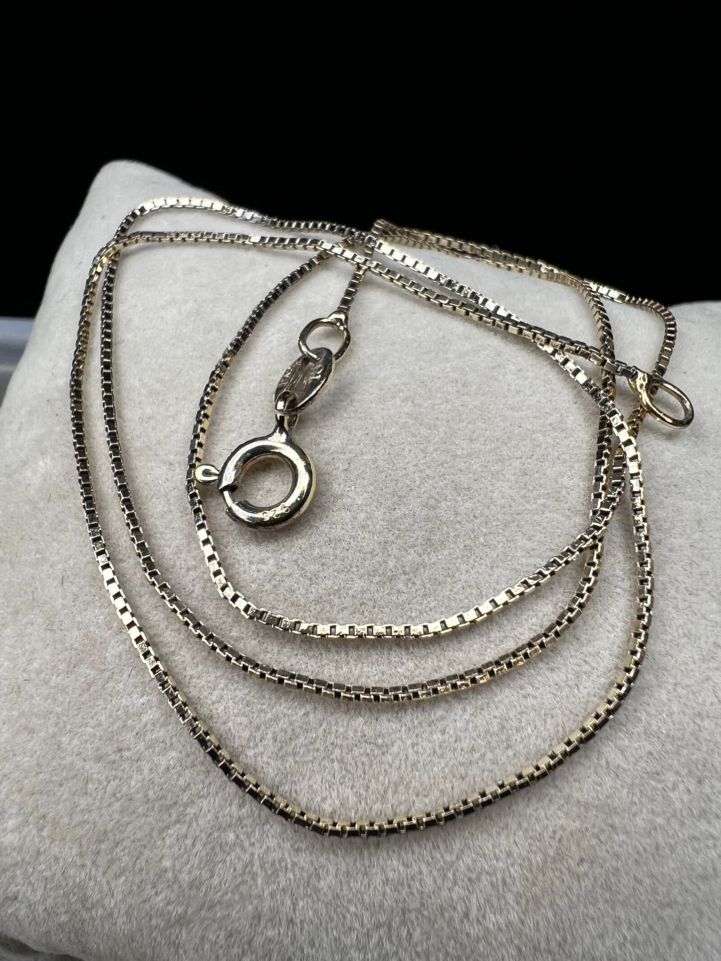 This petite chain, crafted form sterling silver with a gold finish, is built with a tough box link. Wear it alone or pair it with one of our gold-over-sterling pendants.