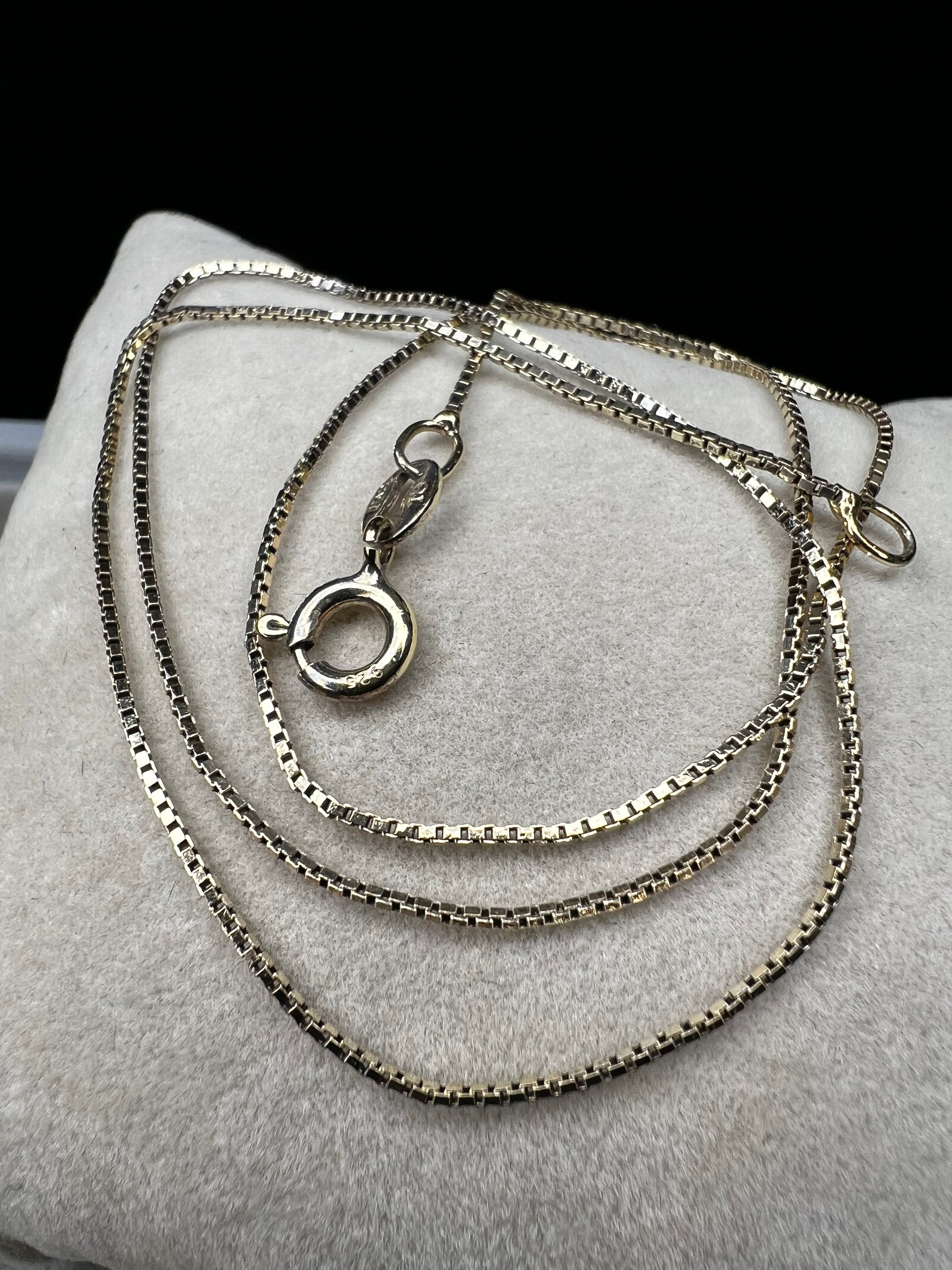 This petite chain, crafted form sterling silver with a gold finish, is built with a tough box link. Wear it alone or pair it with one of our gold-over-sterling pendants.
