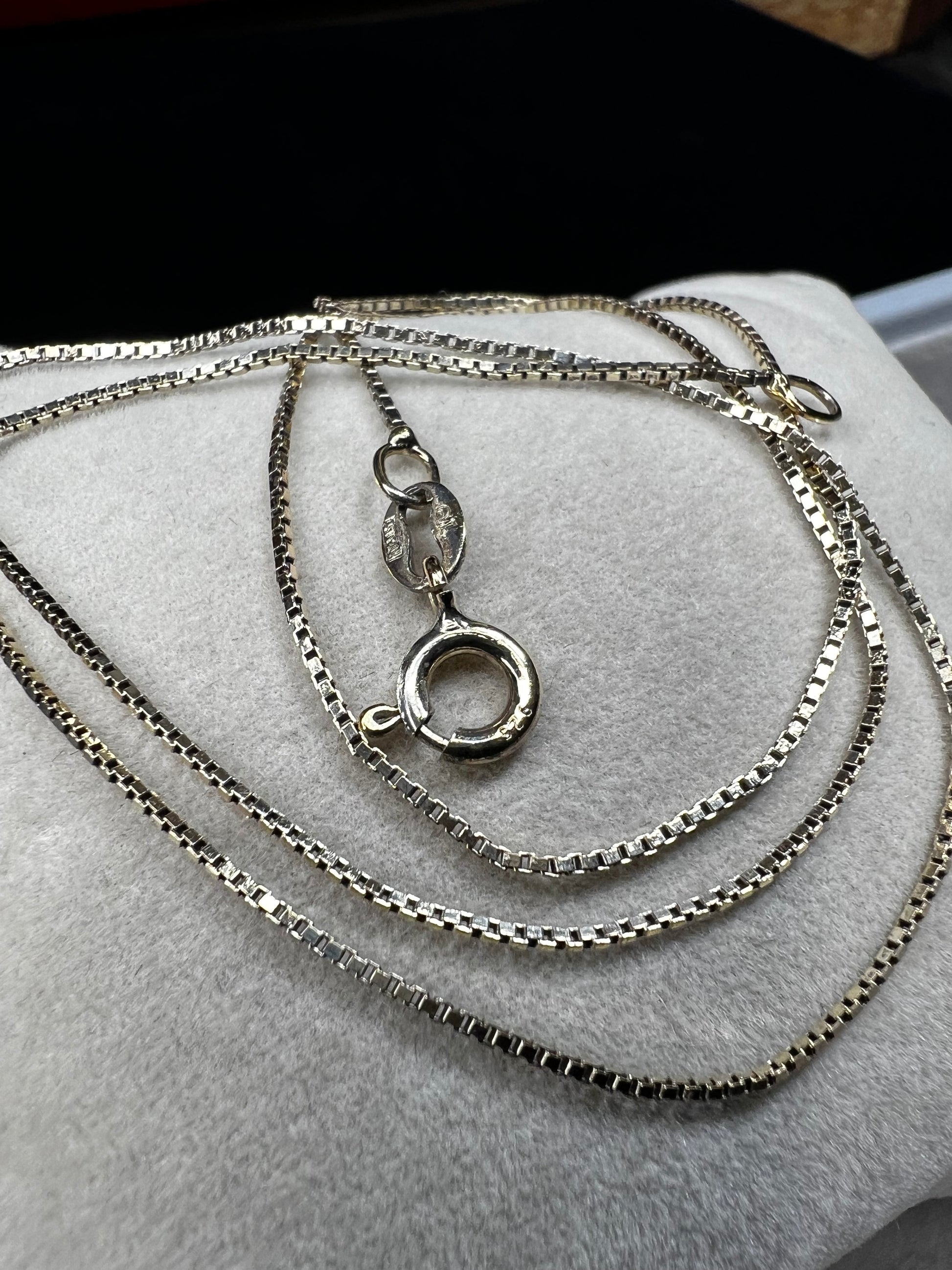 This petite chain, crafted form sterling silver with a gold finish, is built with a tough box link. Wear it alone or pair it with one of our gold-over-sterling pendants.