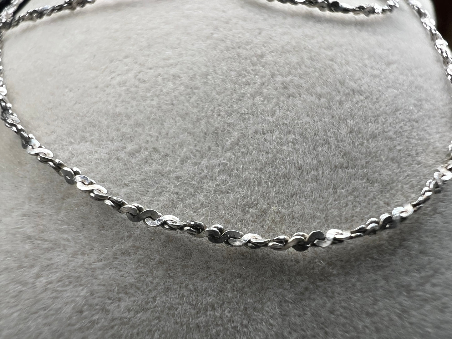 Crafted from sterling silver by Danecraft, a trusted jewelry company, this is a petite but strong chain. It can be worn solo or you can pair with one of our small sterling pendants.