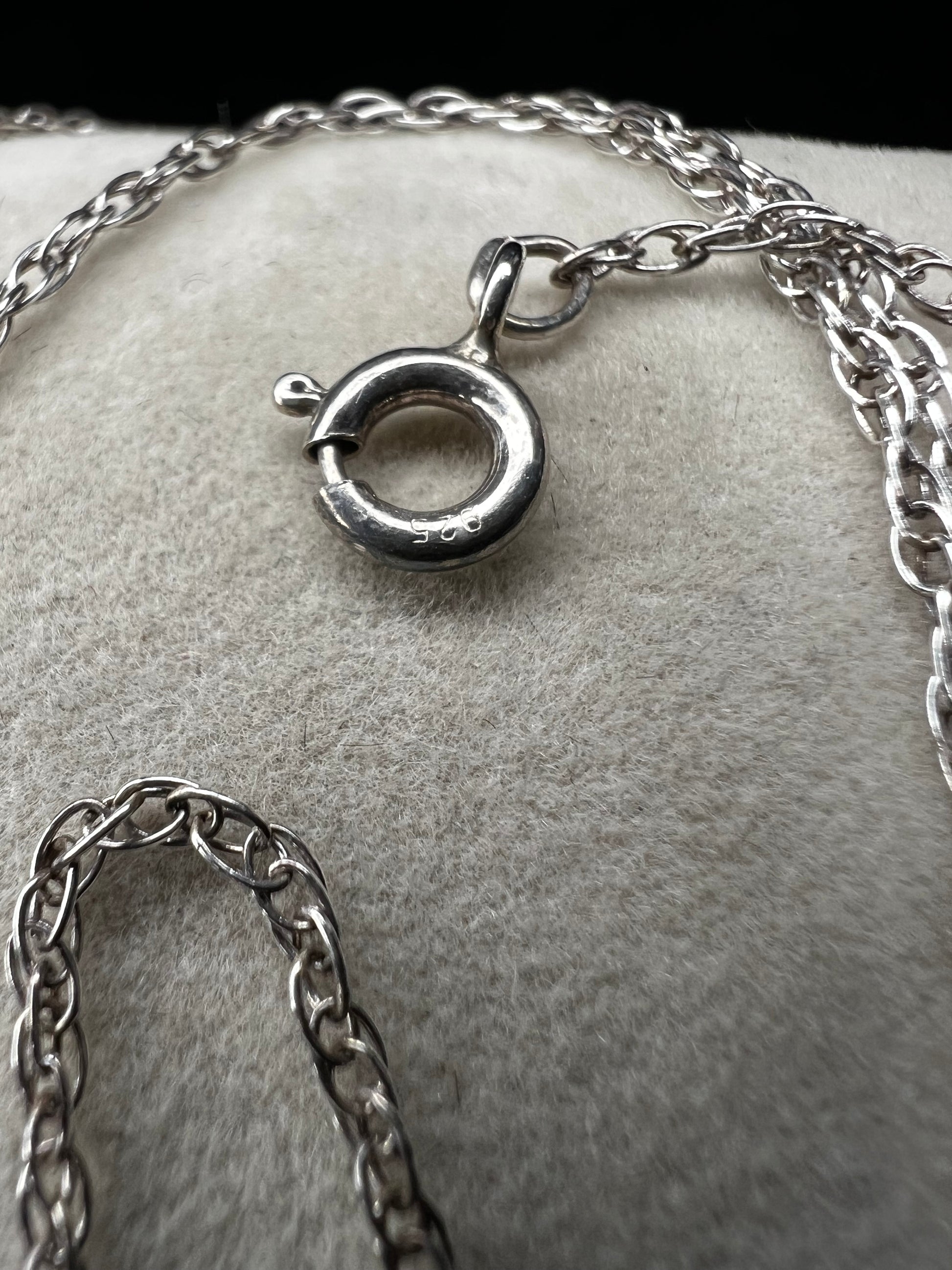 This petite chain is crafted from sterling silver and is ready to be paired with one of our small silver pendants or charms.