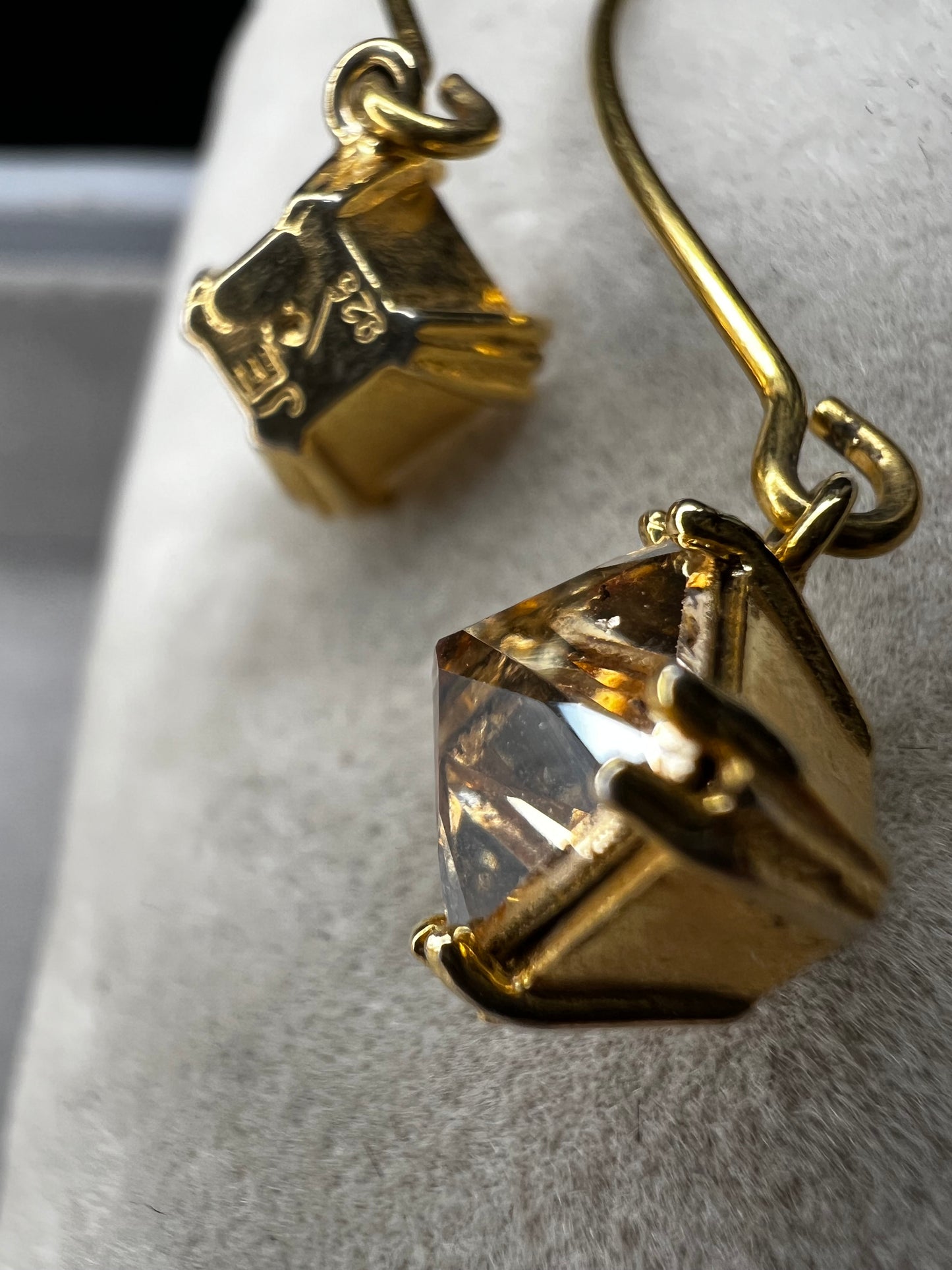 Crafted from sterling silver with a gold-wash finish, these uniquely designed earrings will be great for when you're looking for something a little different.