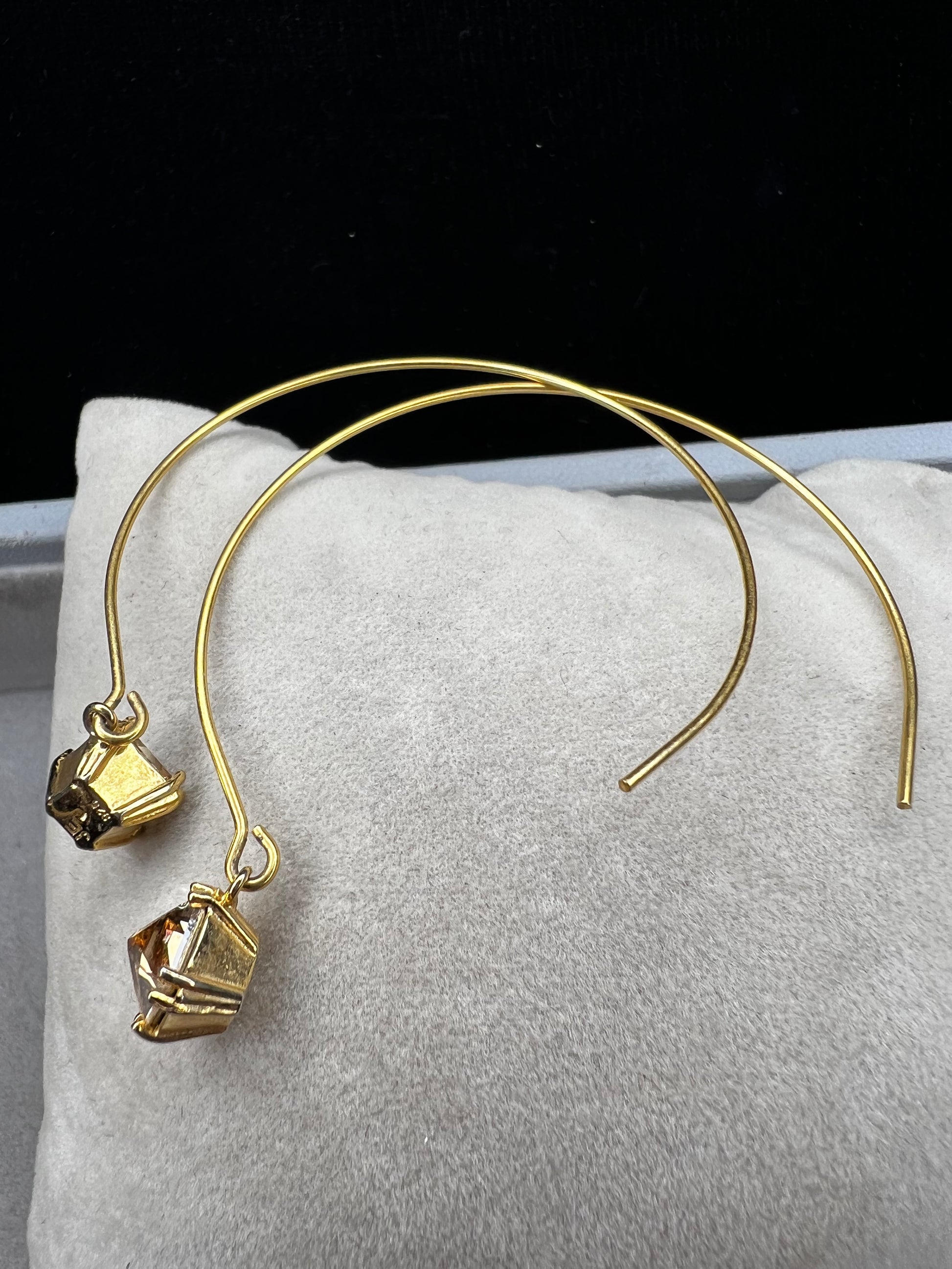 Crafted from sterling silver with a gold-wash finish, these uniquely designed earrings will be great for when you're looking for something a little different.