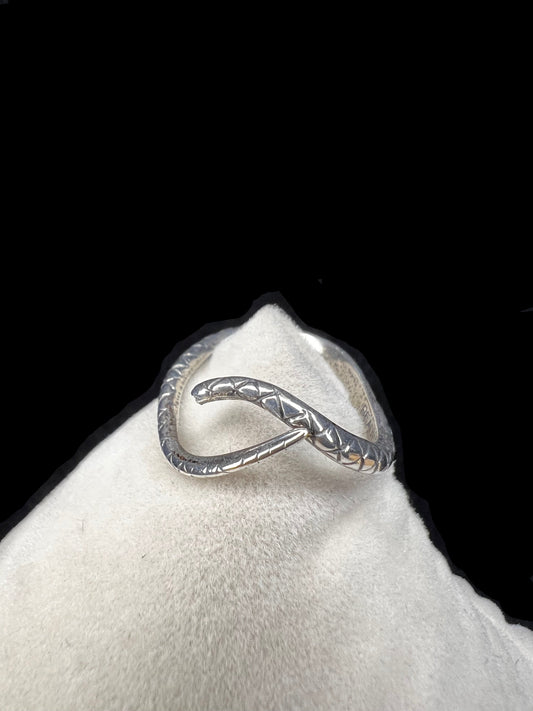 This Beau Sterling ring features a snake design that coils gracefully around your finger. This expertly detailed piece combines artistry and symbolism, offering a bold yet elegant accessory that will enhance any jewelry collection.